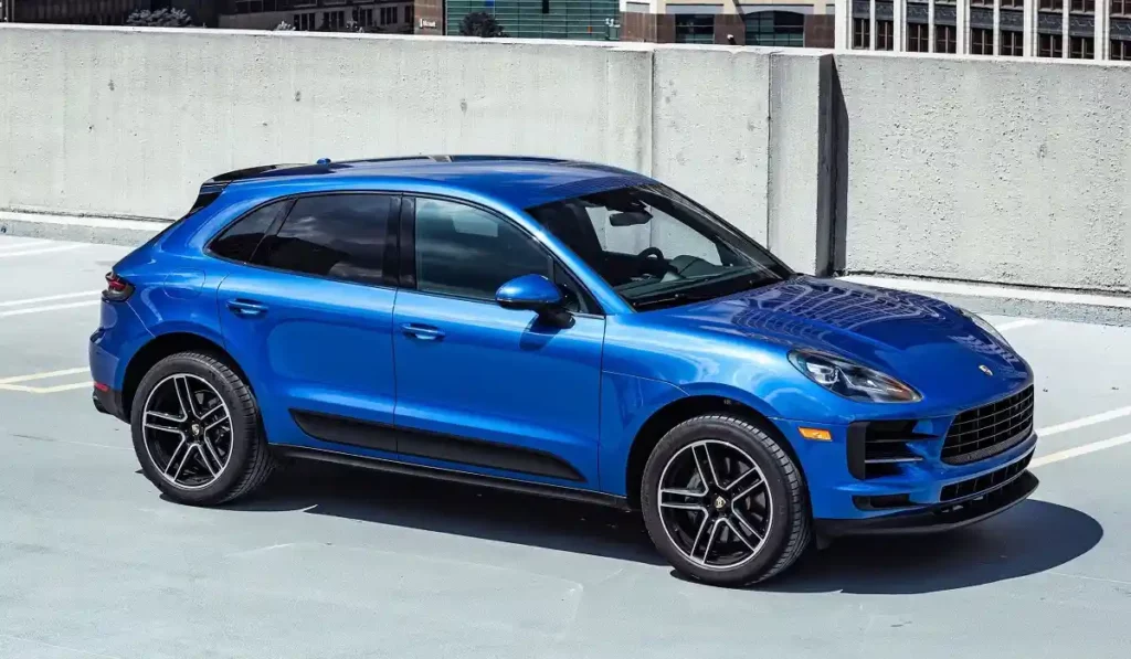 blue Porsche Macan on roof top