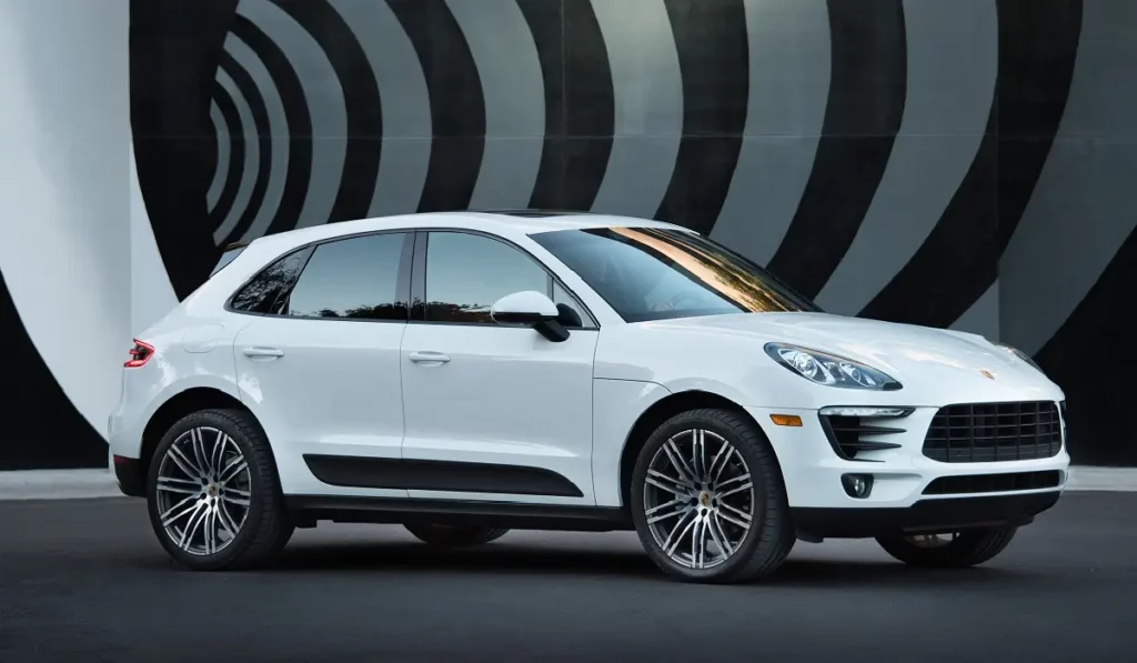 white porsche macan on striped background