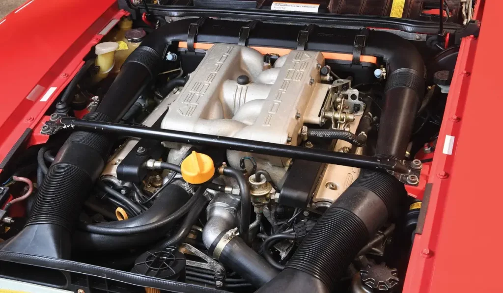 red porsche 928 s4 under the hood engine view